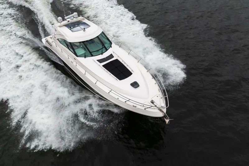 Slide: The Image of 2013 Sea Ray Sundancer 540 cruising on open water, aerial view. - 8
