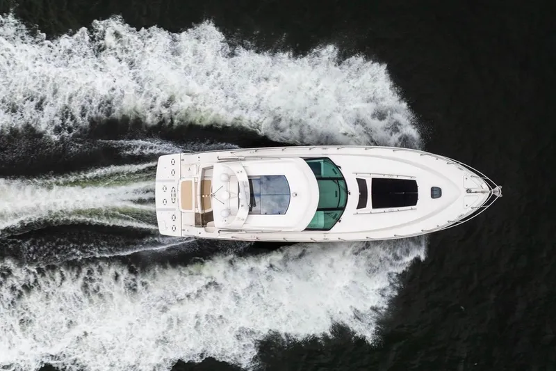 Slide: The Image of Aerial view of 2013 Sea Ray Sundancer 540 yacht cruising on water. - 9