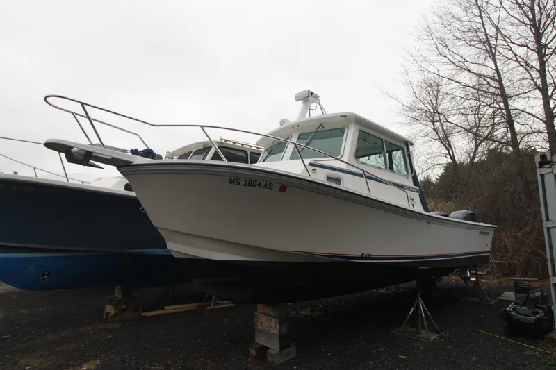 The Image of 2014 Steiger Craft 26 Miami boat on dry dock, overcast day. - 0
