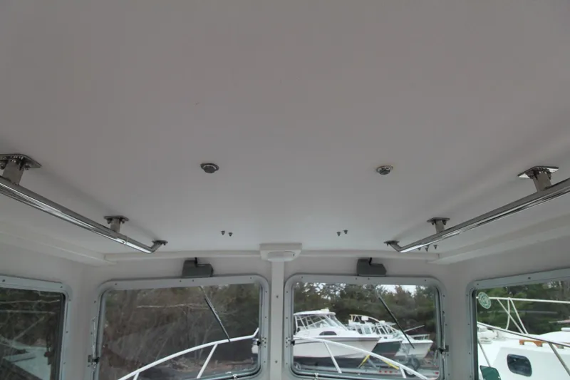 Slide: The Image of Interior view of 2014 Steiger Craft 26 Miami boat cabin ceiling and windows. - 10
