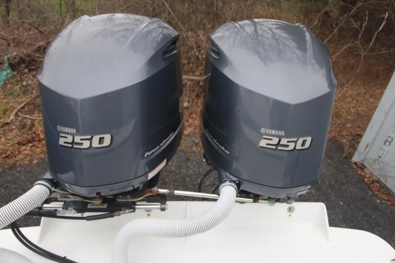 Slide: The Image of Twin Yamaha 250 outboard engines on a 2014 Steiger Craft 26 Miami boat. - 26