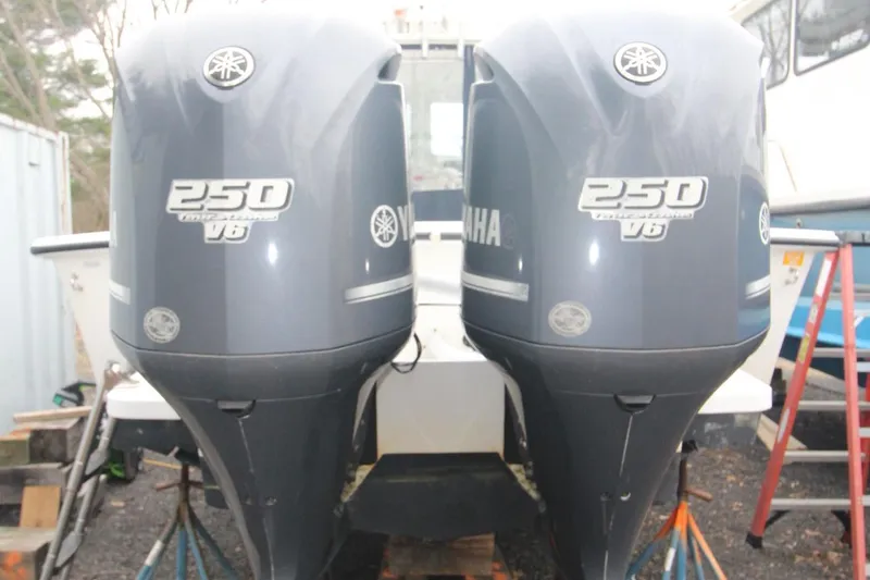 Slide: The Image of Twin Yamaha 250 V6 outboard engines on a 2014 Steiger Craft 26 Miami boat. - 27