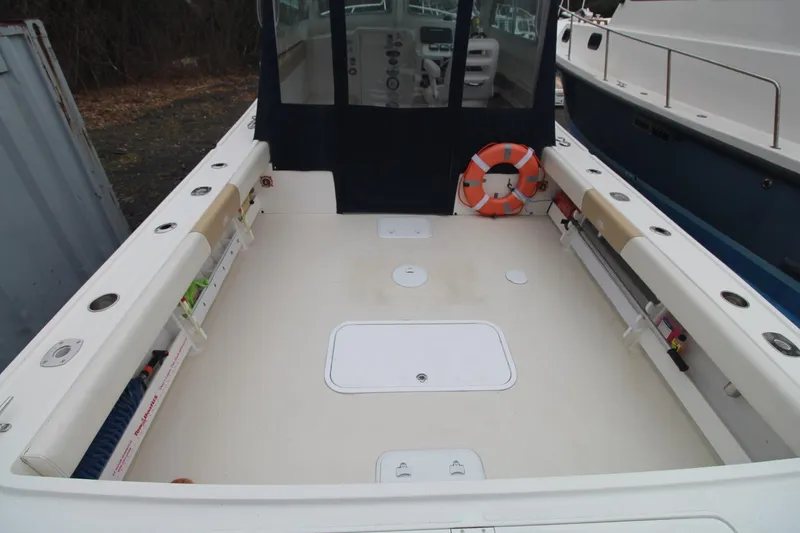 Slide: The Image of 2014 Steiger Craft 26 Miami boat deck with seating and safety equipment. - 5