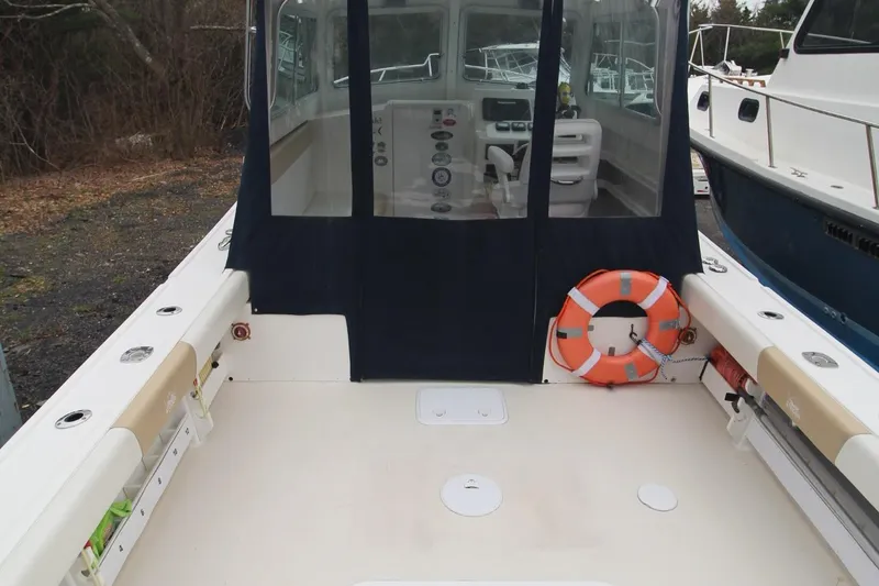 Slide: The Image of 2014 Steiger Craft 26 Miami boat interior with life preserver and seating area. - 6