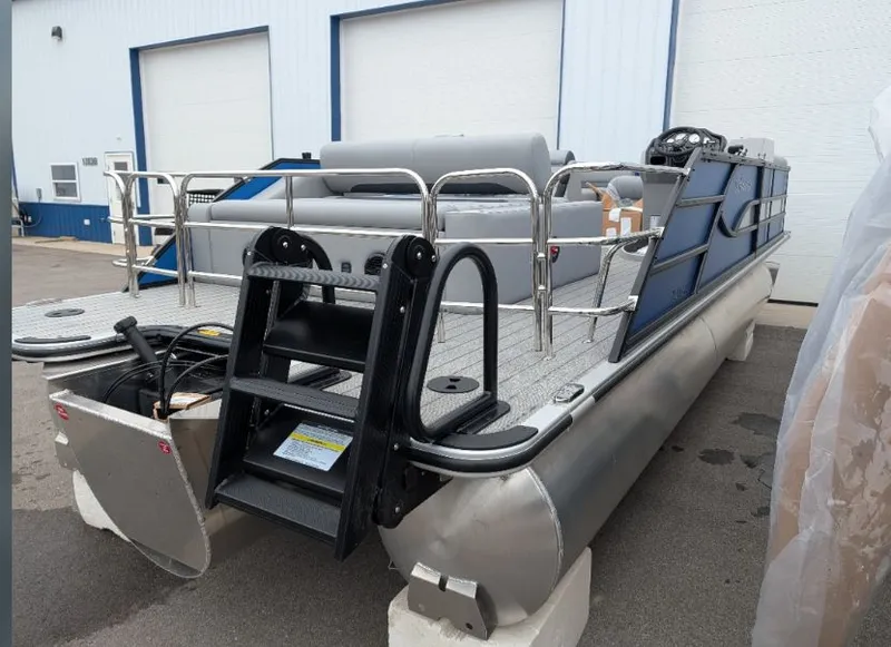 Slide: The Image of 2026 Bentley Legacy 223 Pontoon with ladder, parked outdoors. - 7