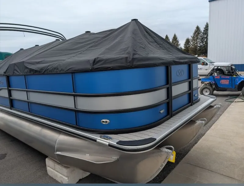 Slide: The Image of 2026 Bentley Legacy 223 Swingnack pontoon boat covered, blue and silver. - 8