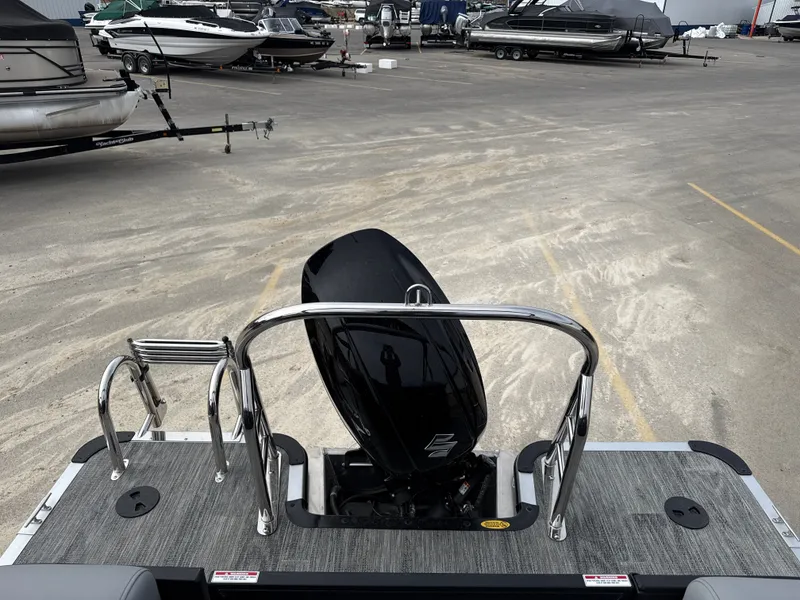 Slide: The Image of Bentley Pontoons 223 Bolt 2026 with outboard motor in parking lot. - 11