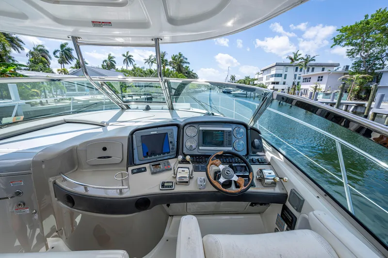 Slide: The Image of Cockpit view of 2005 Sea Ray 420 Sundancer yacht with modern navigation equipment. - 11