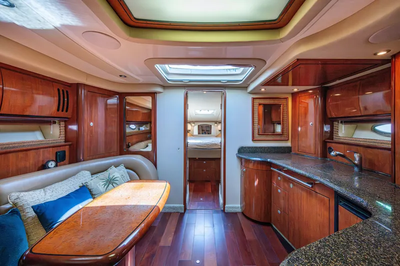 Slide: The Image of Luxurious interior of a 2005 Sea Ray 420 Sundancer yacht with elegant wood finishes. - 14