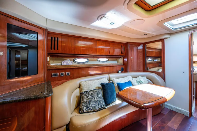 Slide: The Image of Luxurious interior of 2005 Sea Ray 420 Sundancer yacht with plush seating and elegant wood finishes. - 16