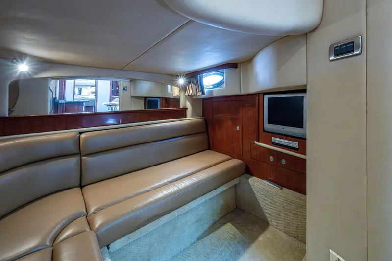 Slide: The Image of Luxurious interior of 2005 Sea Ray 420 Sundancer yacht with leather seating and entertainment system. - 18