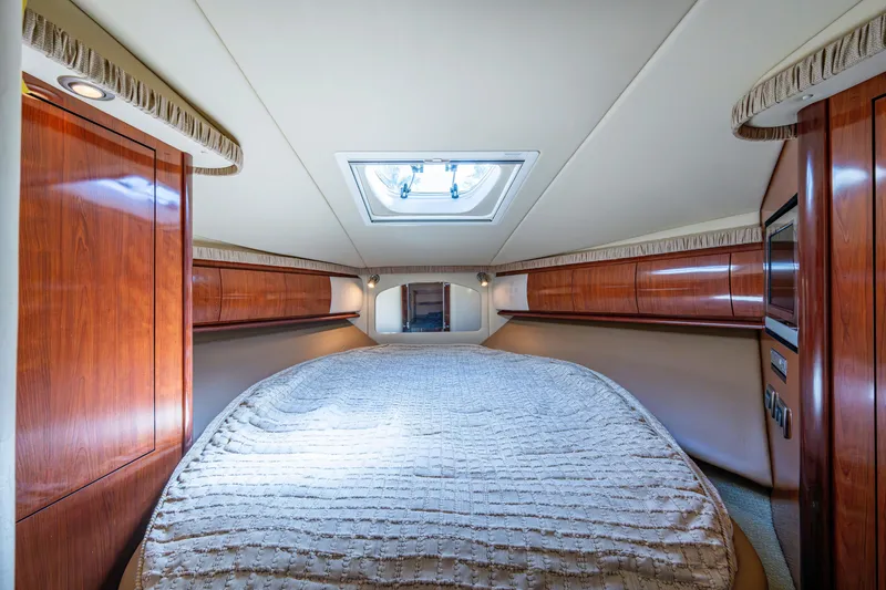 Slide: The Image of Luxurious cabin interior of 2005 Sea Ray 420 Sundancer yacht with skylight and wood finishes. - 19