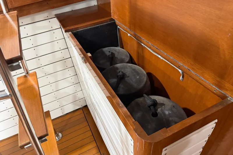 Slide: The Image of Wooden storage compartment on 1986 Skiff Craft X-31 Sportsman Custom boat. - 10