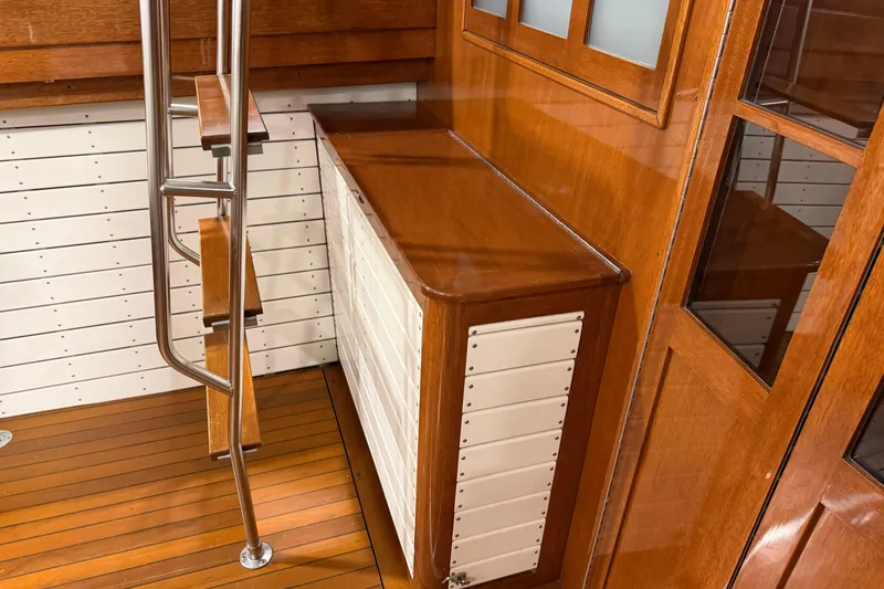Slide: The Image of Interior of 1986 Skiff Craft X-31 Sportsman Custom with wooden and metal details. - 11