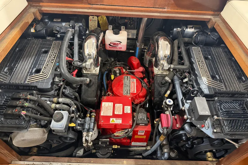 Slide: The Image of Engine compartment of a 1986 Skiff Craft X-31 Sportsman Custom with dual supercharged engines. - 14