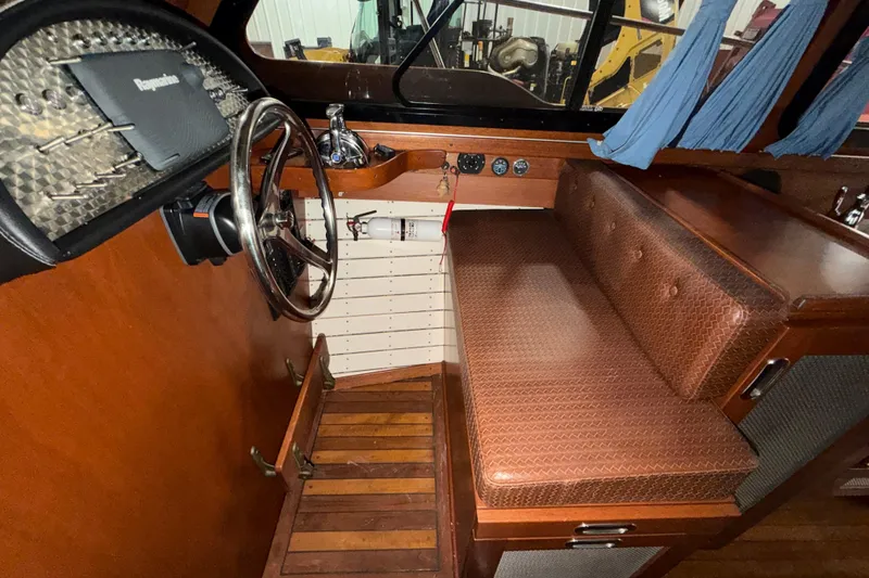 Slide: The Image of 1986 Skiff Craft X-31 Sportsman Custom interior with wooden dashboard and leather seating. - 28
