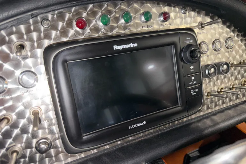 Slide: The Image of Dashboard of 1986 Skiff Craft X-31 Sportsman Custom with Raymarine hybrid touch display. - 29