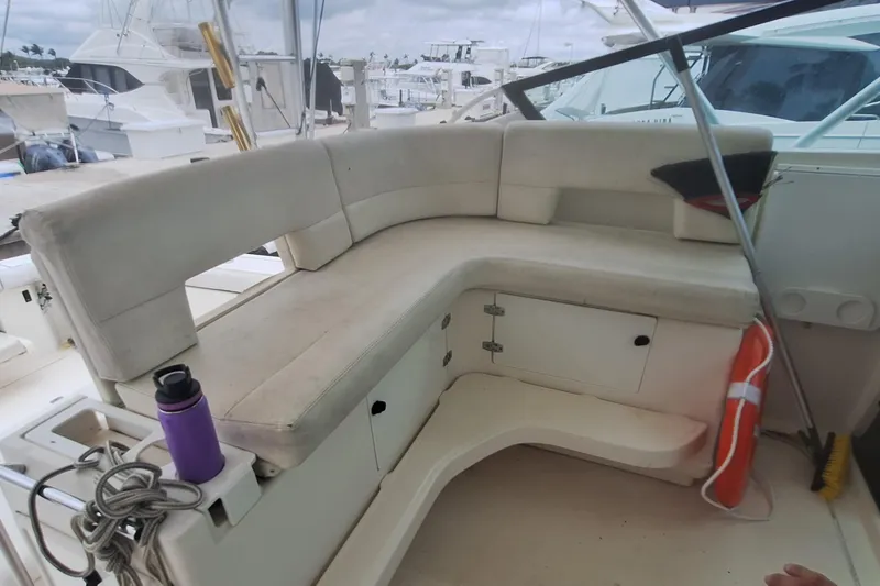 Slide: The Image of 1998 Tiara Yachts 4100 Open boat interior with cushioned seating and storage compartments. - 11