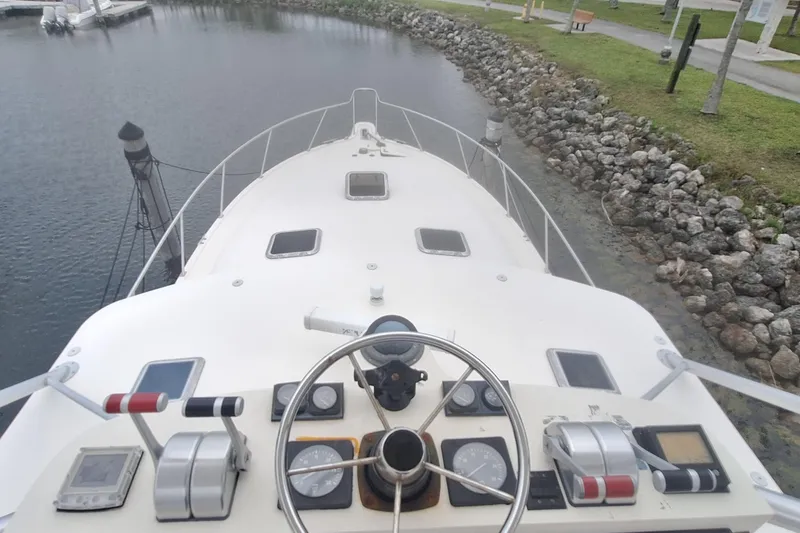 Slide: The Image of Cockpit of 1998 Tiara Yachts 4100 Open by the water. - 3