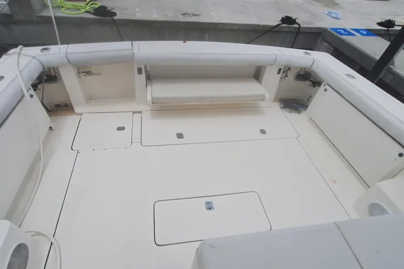 Slide: The Image of 1998 Tiara Yachts 4100 Open boat deck with storage compartments and seating. - 6