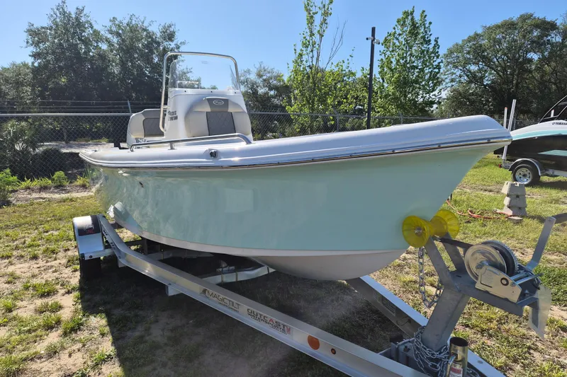 The Image of 2026 Key West 1720 Center Console boat on trailer, parked outdoors. - 1