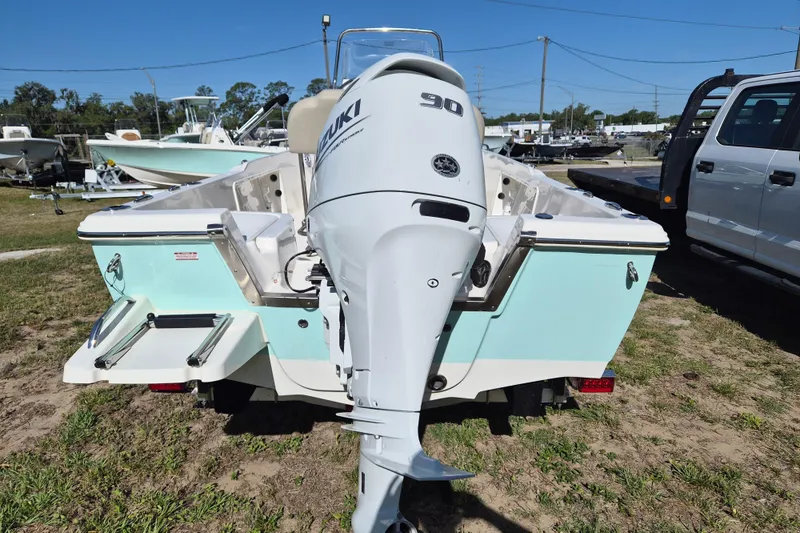 Slide: The Image of 2026 Key West 1720 Center Console boat with Suzuki 90 outboard motor, parked outdoors. - 3