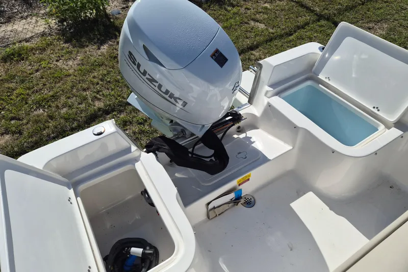 Slide: The Image of 2026 Key West 1720 Center Console boat with Suzuki outboard motor and storage compartments. - 5