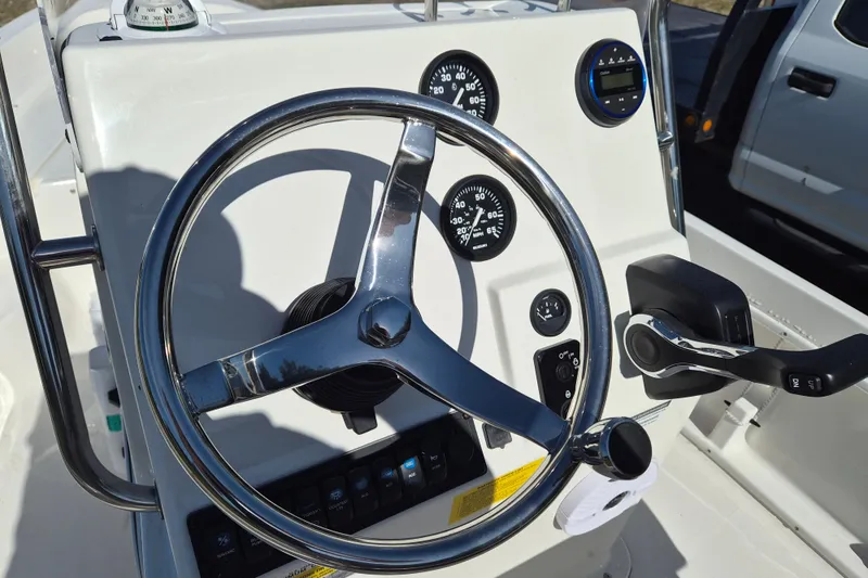 Slide: The Image of Steering console of 2026 Key West 1720 Center Console boat with gauges and controls. - 7