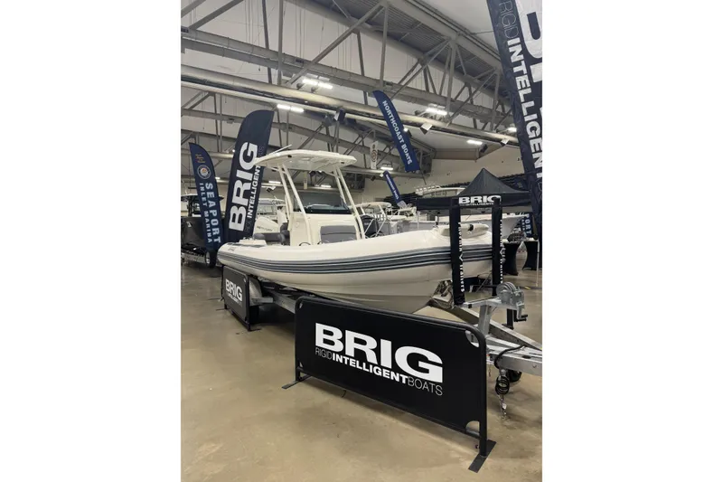 Slide: The Image of 2026 Brig Eagle 6.7 boat displayed at an indoor exhibition with promotional banners. - 17