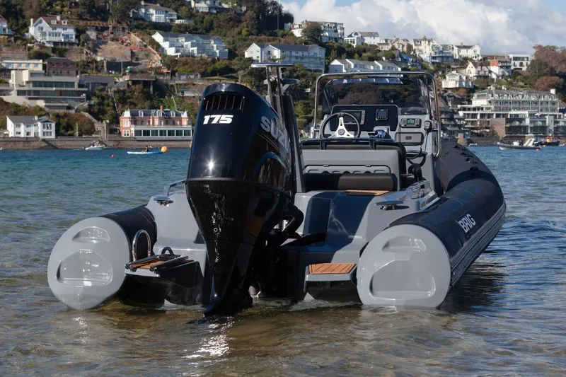 Slide: The Image of 2026 Brig Eagle 6.7 boat with Suzuki 175 engine in scenic coastal setting. - 9