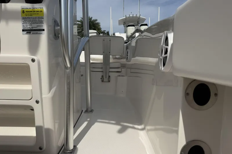 Slide: The Image of 2021 Robalo R200 Center Console boat interior with seating and railing. - 10