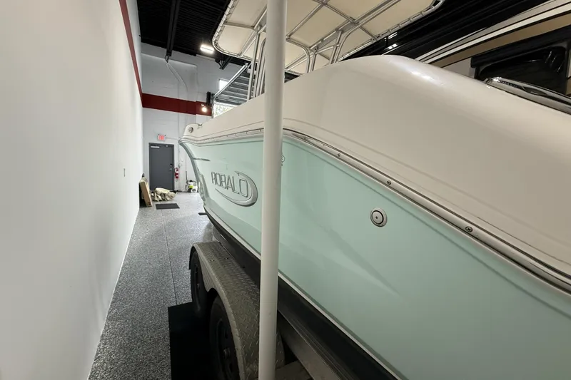 Slide: The Image of 2021 Robalo R200 Center Console boat in indoor storage facility. - 18