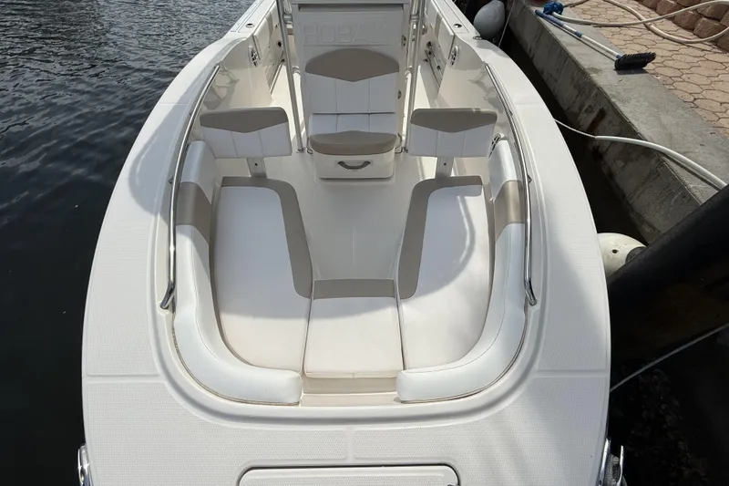 Slide: The Image of 2021 Robalo R200 Center Console boat interior with cushioned seating and sleek design. - 5