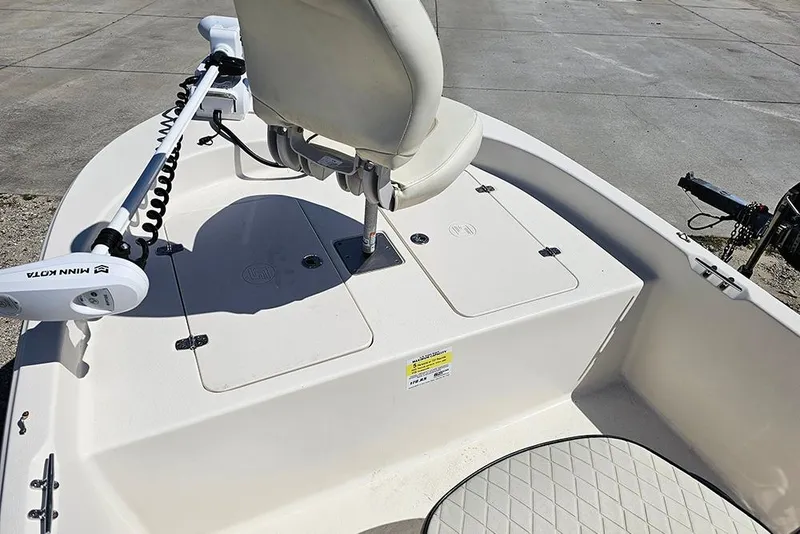 Slide: The Image of 2022 Carolina Skiff 178 JLS boat interior with Minn Kota trolling motor and seating. - 10