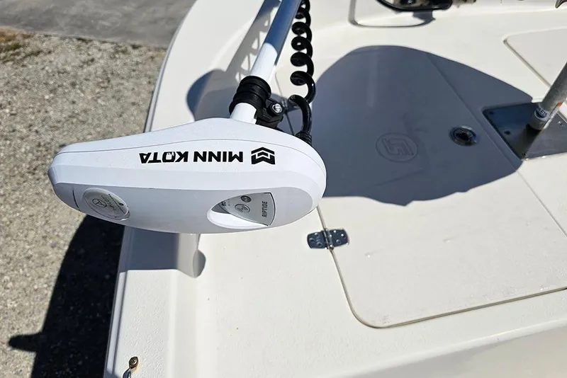Slide: The Image of Minn Kota trolling motor on 2022 Carolina Skiff 178 JLS boat deck. - 14