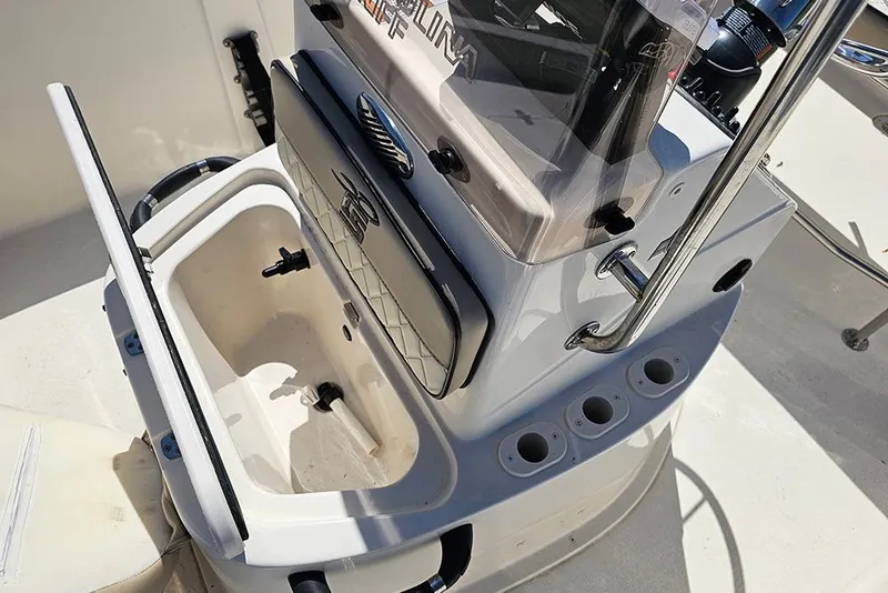 Slide: The Image of 2022 Carolina Skiff 178 JLS boat console with storage compartment and rod holders. - 16