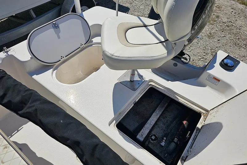 Slide: The Image of 2022 Carolina Skiff 178 JLS boat interior with storage compartments and seating. - 21