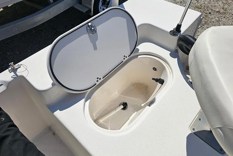 Slide: The Image of Open storage compartment on a 2022 Carolina Skiff 178 JLS boat. - 22