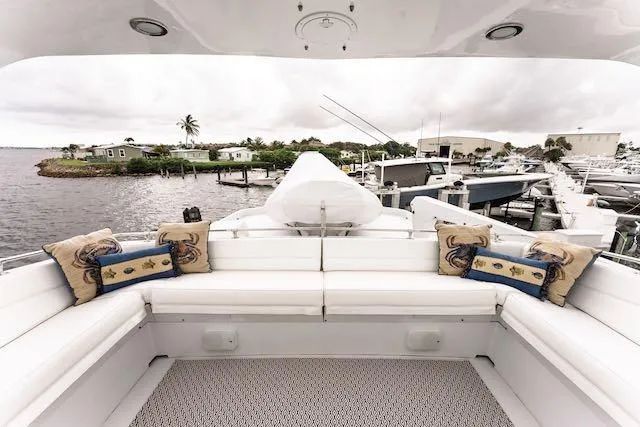 Slide: The Image of Luxurious 1999 Hatteras 74 Sport Deck Motor Yacht with spacious outdoor seating area. - 13