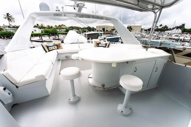 Slide: The Image of Luxurious interior of 1999 Hatteras 74 Sport Deck Motor Yacht with plush seating and elegant decor. - 18