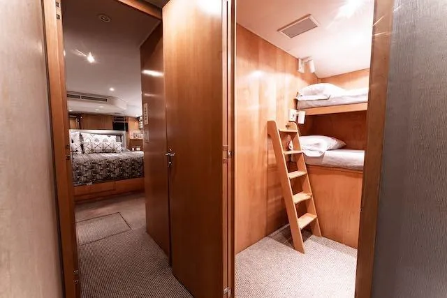 Slide: The Image of Luxurious bathroom in 1999 Hatteras 74 Sport Deck Motor Yacht with dual sinks and elegant decor. - 27