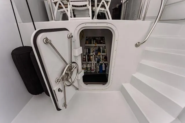 Slide: The Image of Luxurious dining area on 1999 Hatteras 74 Sport Deck Motor Yacht with elegant table setting. - 3