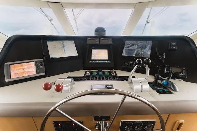 Slide: The Image of Luxurious bedroom interior of 1999 Hatteras 74 Sport Deck Motor Yacht with cozy bedding. - 31