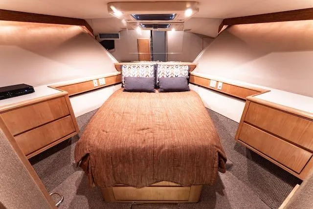 Slide: The Image of Bathroom interior of 1999 Hatteras 74 Sport Deck Motor Yacht, featuring modern fixtures and ample lighting. - 34