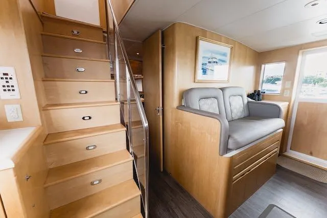 Slide: The Image of Control panel of a 1999 Hatteras 74 Sport Deck Motor Yacht with navigation screens. - 39