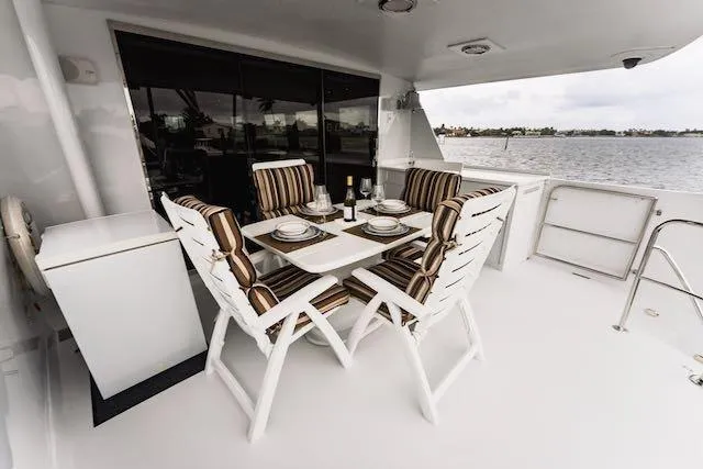 Slide: The Image of Staircase and door on 1999 Hatteras 74 Sport Deck Motor Yacht by the water. - 40