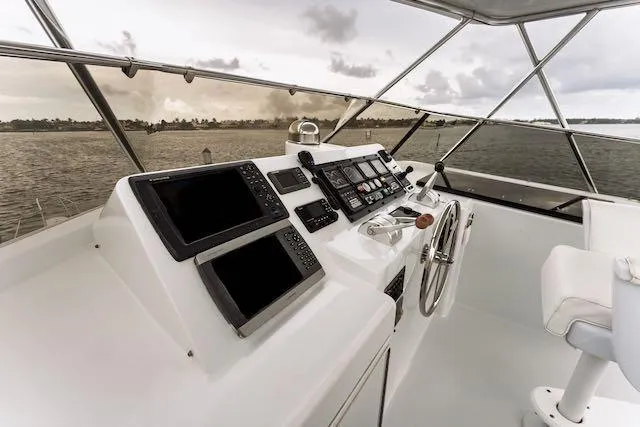 Slide: The Image of Hatteras 74 Sport Deck Motor Yacht 1999, open hatch revealing storage area with supplies. - 41
