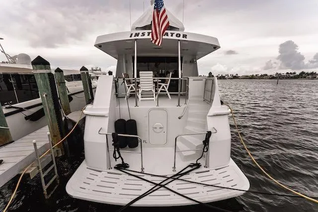 Slide: The Image of Helm of 1999 Hatteras 74 Sport Deck Motor Yacht with navigation equipment and steering wheel. - 7