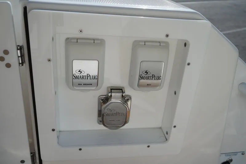 Slide: The Image of 2024 Edgewater 285CC boat featuring SmartPlug electrical outlets for enhanced safety and convenience. - 13