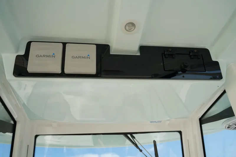 Slide: The Image of 2024 Edgewater 285CC boat with Garmin electronics installed on the dashboard. - 26